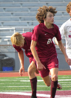 Locked in. Senior Justin Bossler goes for the ball like Coach McCarter guides him to do. 