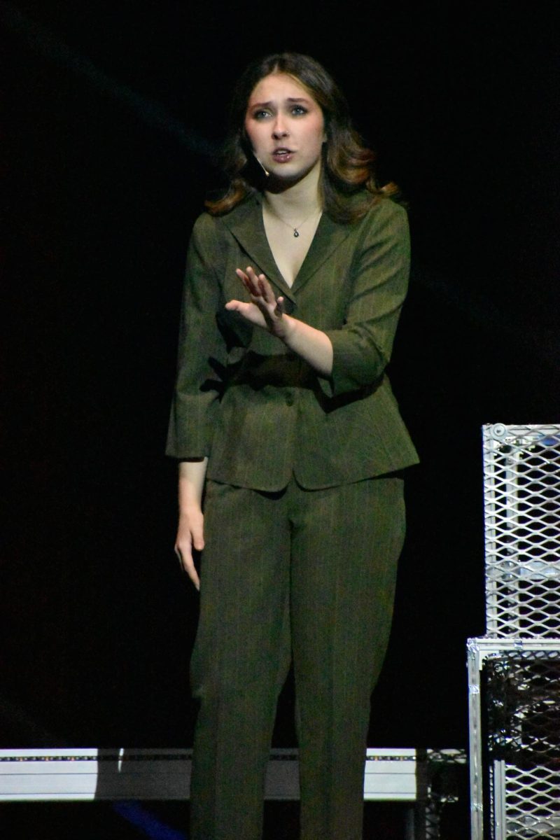 "They look like people but they aren't." Senior Skylar Rutherford plays her part as Marion Jay explaining to the audience the dangers of paradox. She tried to warn the audiences for the moments to come. 