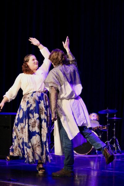 Samara Wertz and Owen Carmel high five at the end of their performance,  “The Song That Goes Like This” from “Spamalot.”