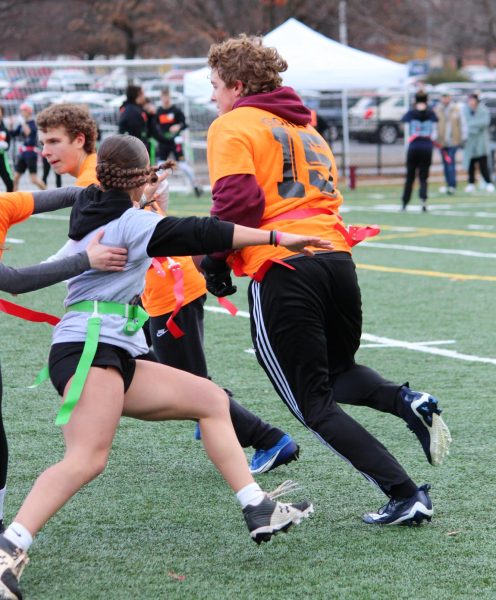 Tackle. Players from Stuffin' Stompers play in the Turkey Bowl morning games. The preliminary games were held in the morning to determine who would move onto the finals. 