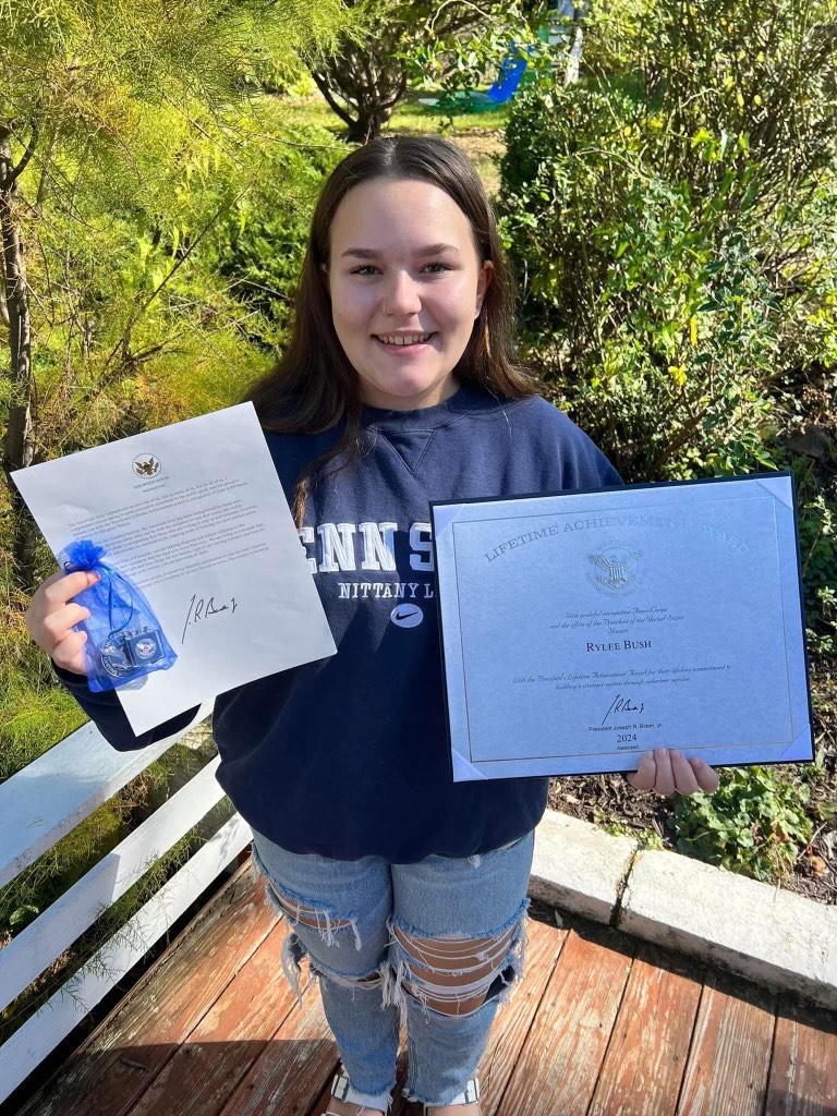 Proud moment. Junior Rylee Bush displays her award. The Presidential Lifetime Achievement award is given once a recipient accumulates 4000 hours of devoted time to their community. (Courtesy of Jackie Russo)