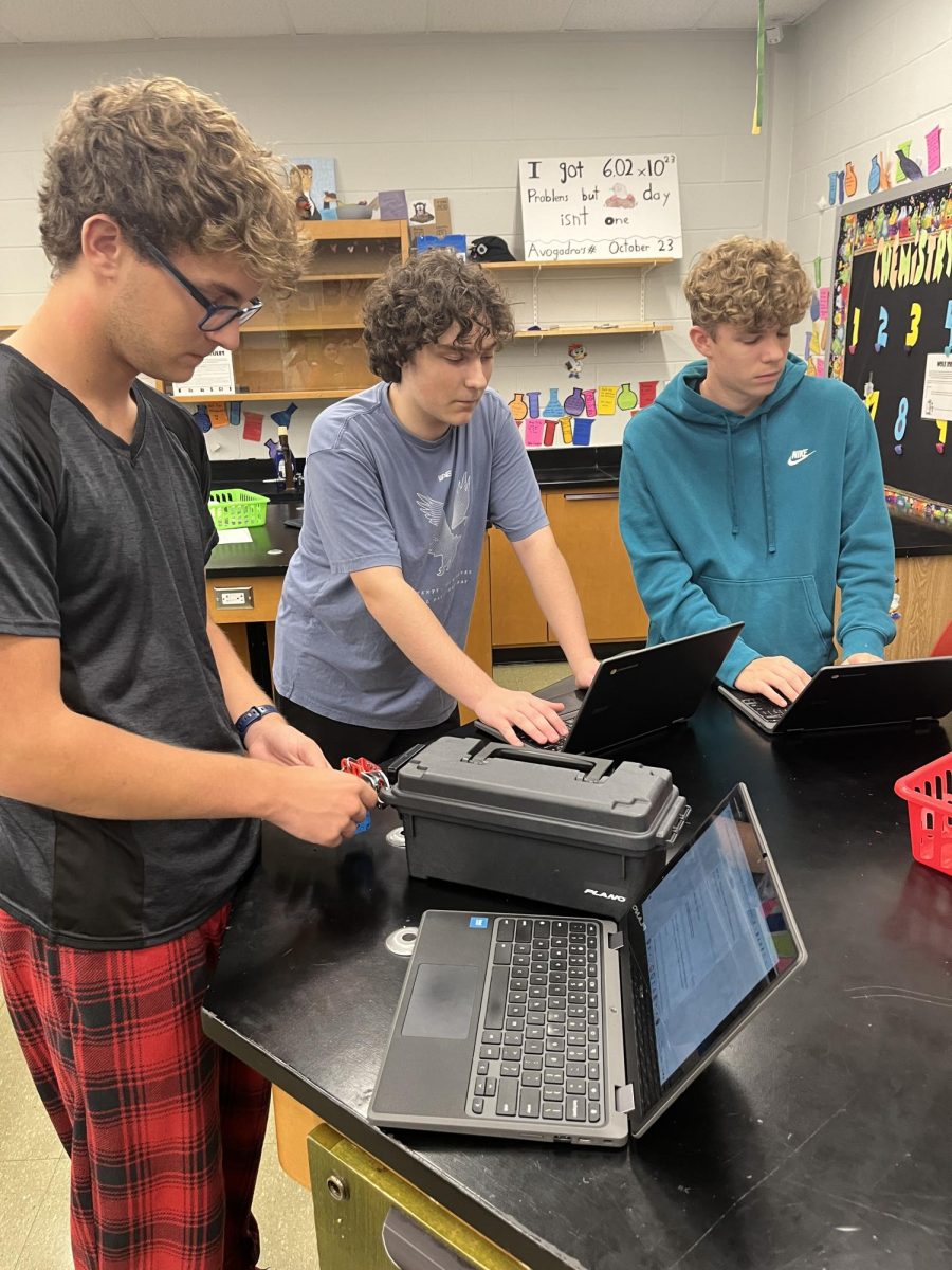 All locked up. Students are tasked with unlocking a lock box by solving mole equations. 