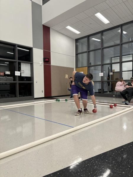 On a roll. Senior Connor Smith rolls for the red team and makes a “perfect shot,” according to the teams bocce coach. Smith will compete with the bocce team.