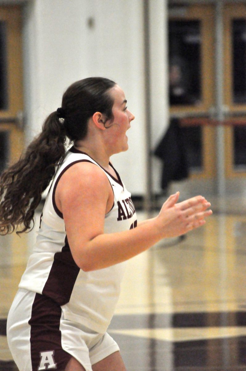 Ready steady! Raylin Eyer stood with her arms wide, ready to receive the pass. She keeps her eyes locked on the ball in preparation.