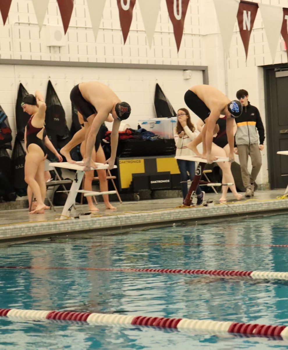 Ready, set, go. Swimmers prepare to dive in at a meet held last year. The swim team will compete against Richland and Cambria Heights in a double-dual meet. (Courtesy of Madalyn Miller)