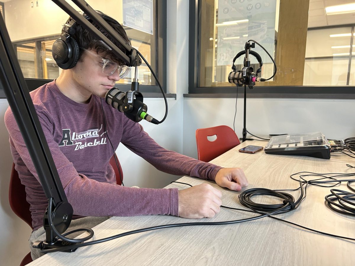 Chit chat. One of the biggest means of content in the "Alpha male" circle is podcasting. Many young men, such as the pictured junior Kody Webster, have been inspired to make the same kind of content. 