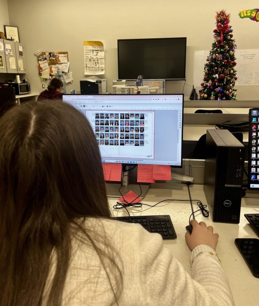 Hard Work! Editor in Chief Addisen McDonald works hard to get the senior page done for the yearbook. Photos must be turned in on time or else they will not be featured in the yearbook.