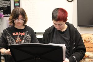 Working hard or hardly working. Senior Cadence Heidler and Junior Archer Makarikas read over their scripts for the Thespian December showcase. Ben Cossitor's Advanced and Studio Theater class have been working for the past five weeks to get their performances ready for an audience. (Courtesy of Lilly Stahlman.)