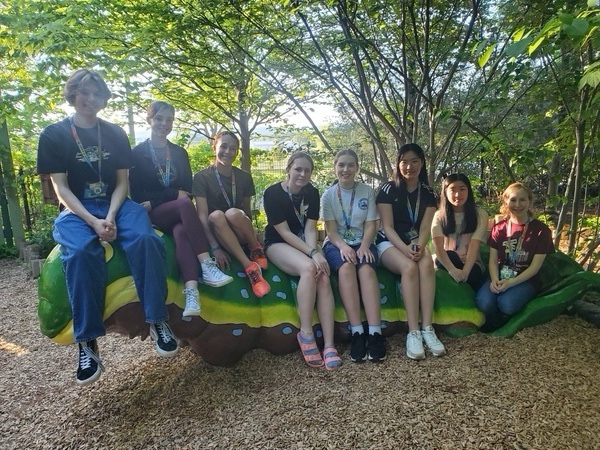 Crawl to victory. Junior Academy of Science members pose on a statue of a caterpillar during their 2023 state competition. Junior Academy of Science members may advance to the state competition. 