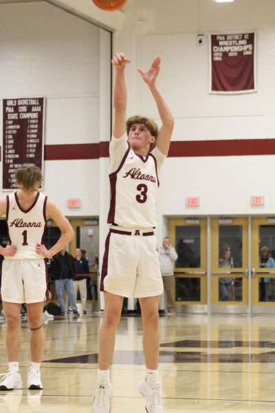 Scoring points. Junior Chris Wagner played hard against rival Hollidaysburg. The boys lost the game. (Courtesy of Lily Stahlman)