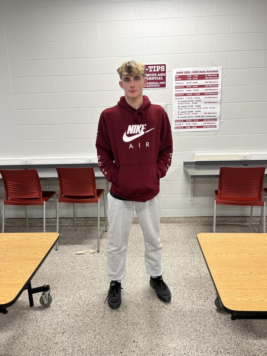 Freshmen Jackson Fennessey wears the colors maroon and white perfectly to show off his Altoona pride.