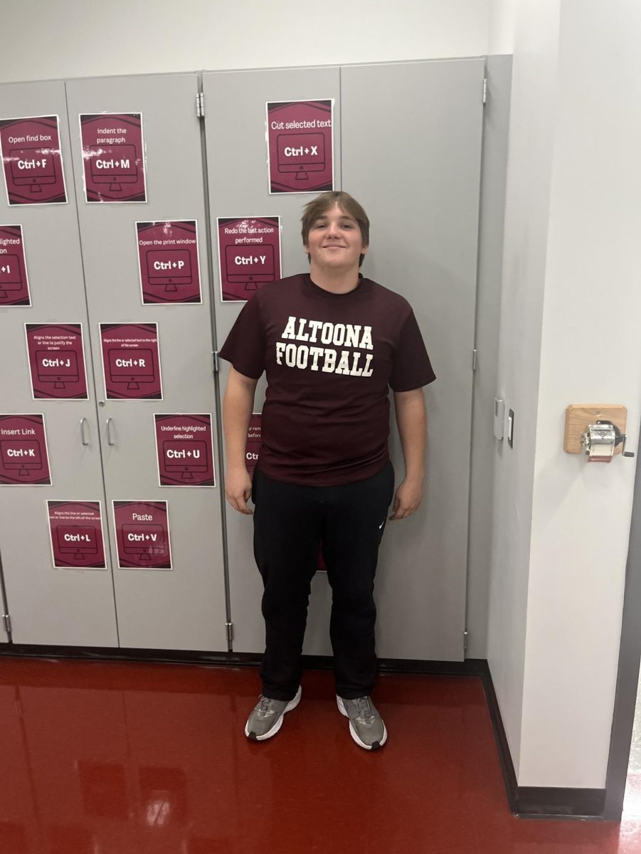 Sophomore Ryan Palladini expresses his Altoona pride with his white and maroon outfit.