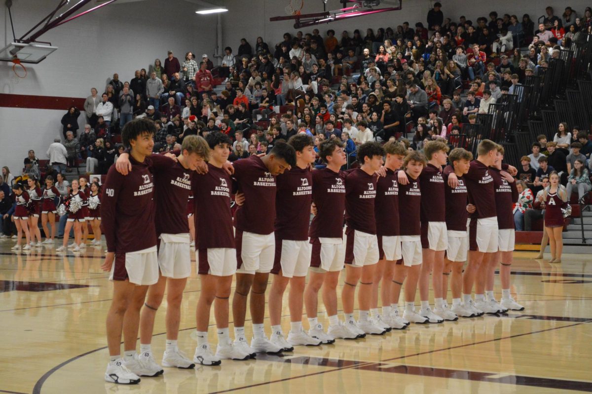 Go Mountain Lions. The varsity boys basketball team lines up for the national anthem. They played on Dec.20 against Chambersburg. 