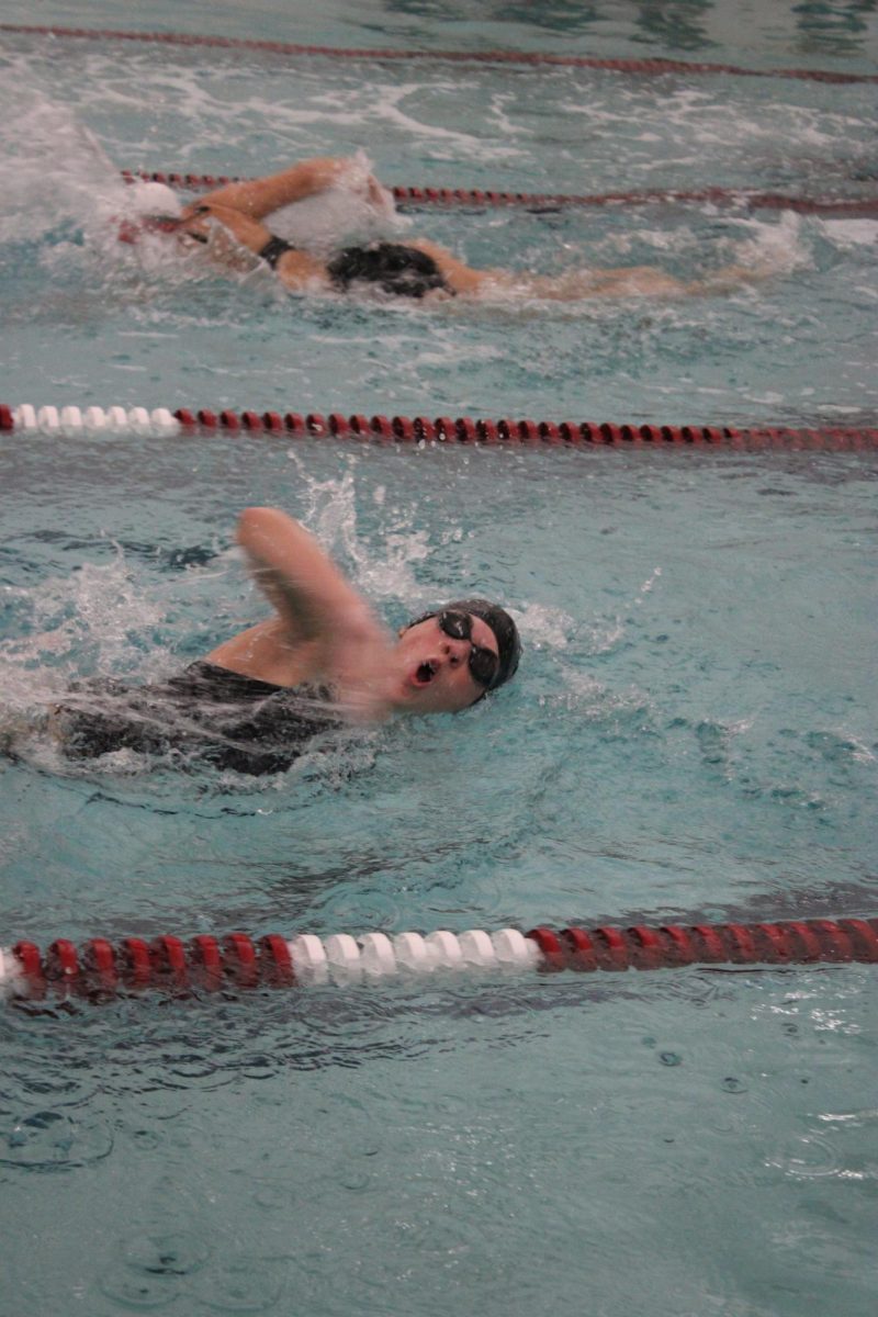 Sprint. Sophomore Abigail Harkins swims in the 200 yard freestyle relay. In this relay, four people each swim a 50 yard freestyle. (Courtesy of Isabella Foor)