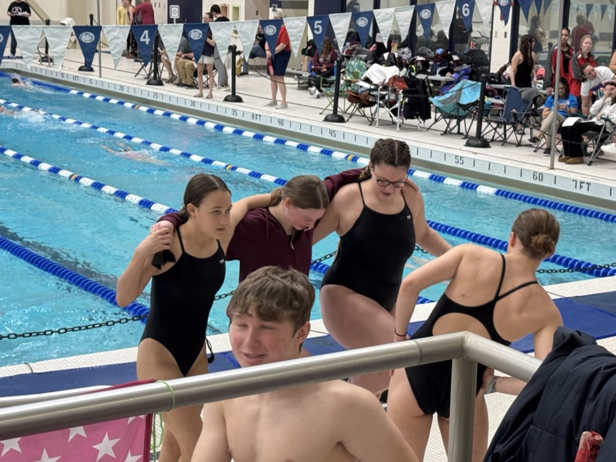 Lana Luke, Sofia Hallinan, and Charlie Kephart warm up together. 