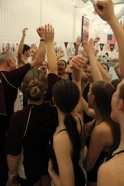 The swim team does their final cheer together after the meet. Seniors gave speeches following the meet, creating emotion. 