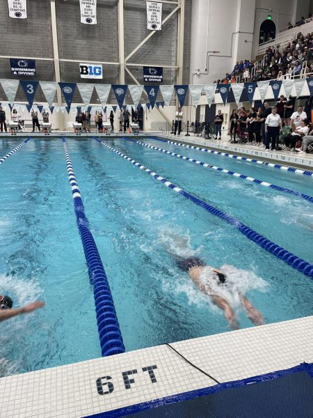 Trevor WIlson goes into his last flip turn of the 100 meter backstroke race. 