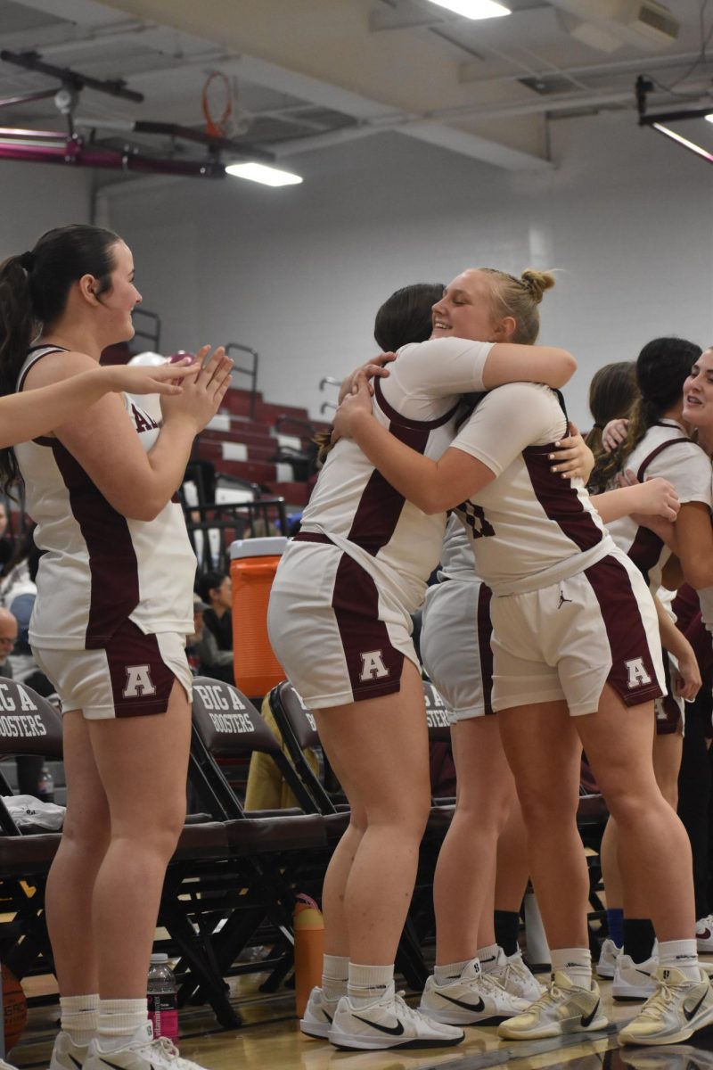 Senior Melana Eyer hugs her team after playing in the game on february 10th