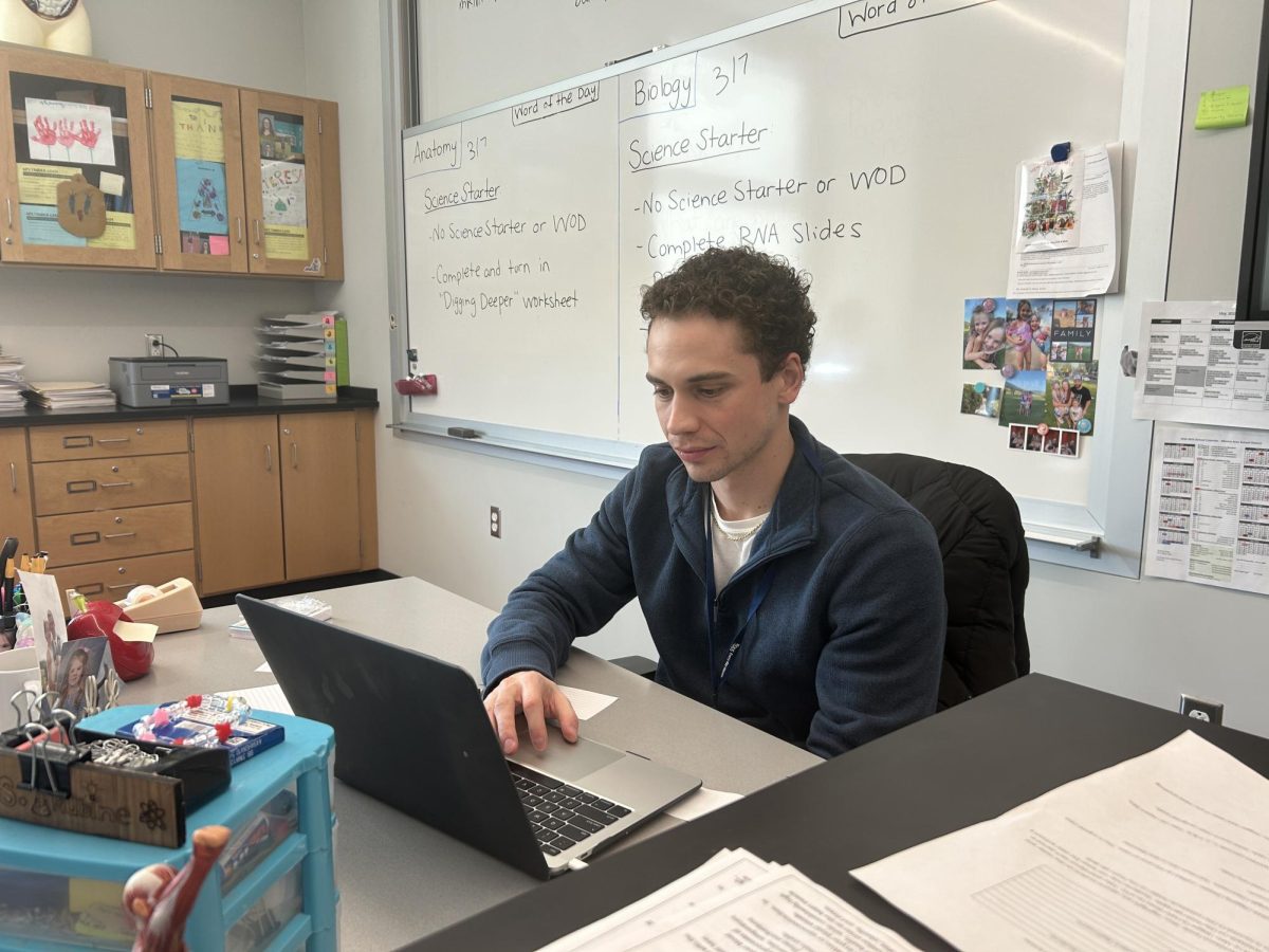 Hard at work. Substitute teacher Harrison Pellegrine works as he watches over his class.