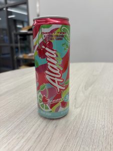 A student displays her Alani energy drink in class. 
