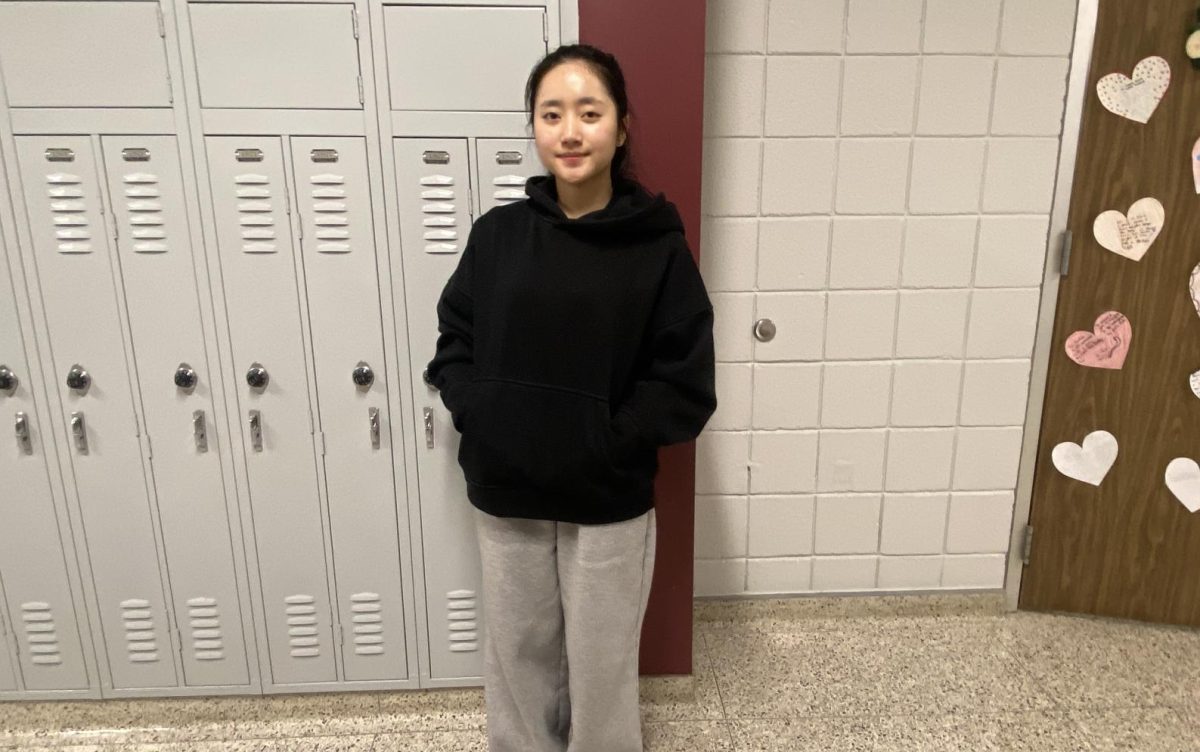 New student Huyen Nquyen poses in the hall. Nguyen moved to this school recently from Vietnam.