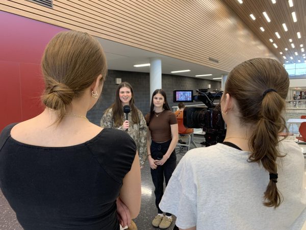 Shot. Sophomore Giana Fiore, sophomore Madilynn Switzer, junior Codey Burns and sophomore Mackenzie Lego work on an edit about hunger. "We're doing an edit about what to do if you don't have enough food at home," Fiore said.