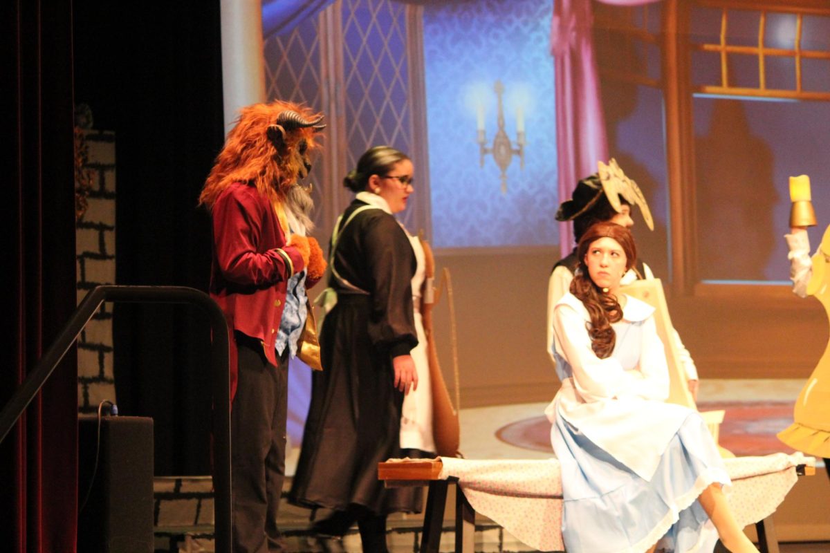 Beauty and the Beast. Belle and the Beast have an argument. The audience was given fake candles to hold up throughout the musical. 