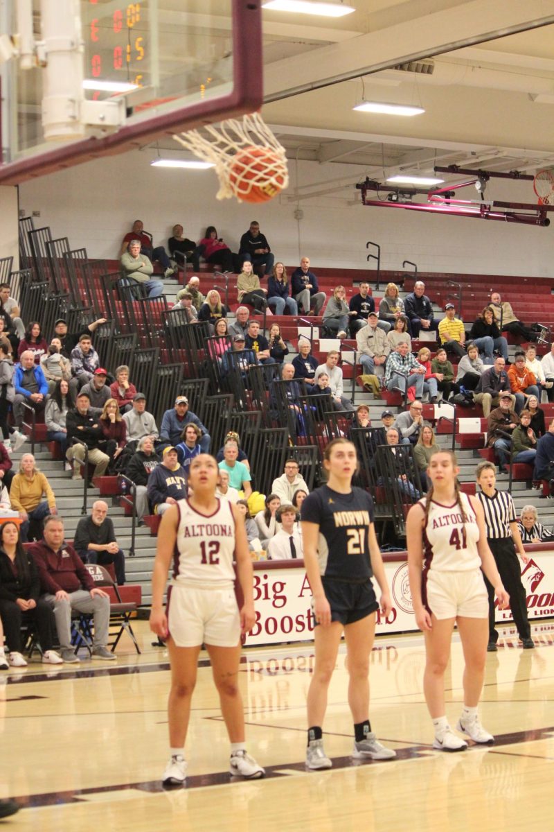 Free throw. The two teams line up for Norwin to shoot a free throw. This game took place on March 7. 