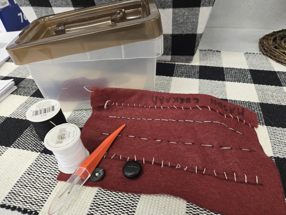 A spool of thread and kindness. Cron hosts a Mending Clinic with her Introduction to FCS students during their sewing unit where students and staff in the district can submit clothing to be mended. Students work on the basic stitches first in sampler projects and then apply their knowledge to fix the items of clothing. "I have some kids that are really good at basic skills, and usually those are the ones who want to jump in," Cron said. "It takes a 'taste,' like a sampler, to the next level." (Photo contributed by Betsy Cron)