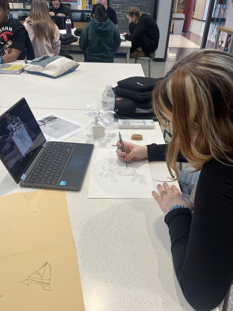 Freshmen Abigail WIlliams works hard on her art project. 