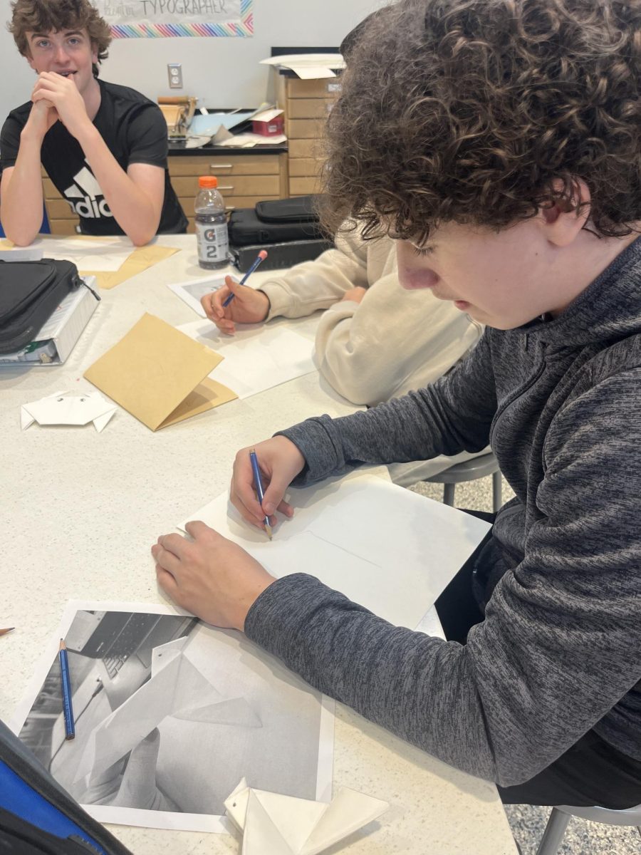 Mason Lockard works hard on her art project.