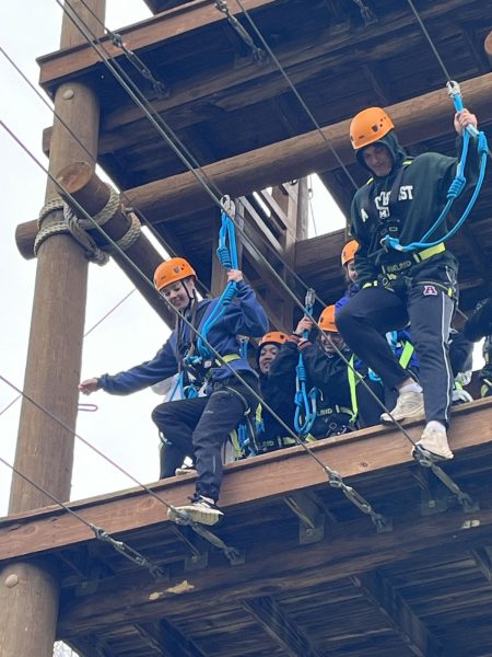Bring it on. Senior Rachel Kennedy and Mark Harrington Jr. challenge themselves on the rope course. 