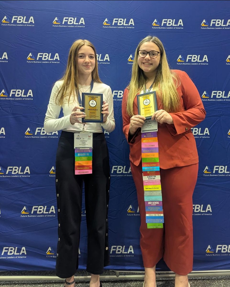 State placers. Seniors Courtney Irwin and Charlie Kephart gather together after the awards ceremony at Hershey Park. Irwin placed ninth in Economics and Kephart placed eighth in Journalism. (Courtesy of Wanda Vanish)