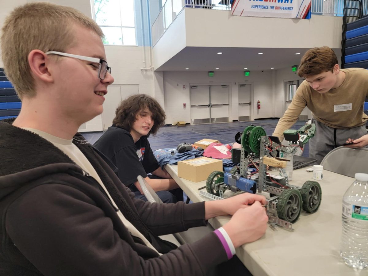 Robotics engineers. Seniors Evan Esper and James Evans work on their robot at the SEAL competition. 
(Courtesy of Jesse Frailey) 