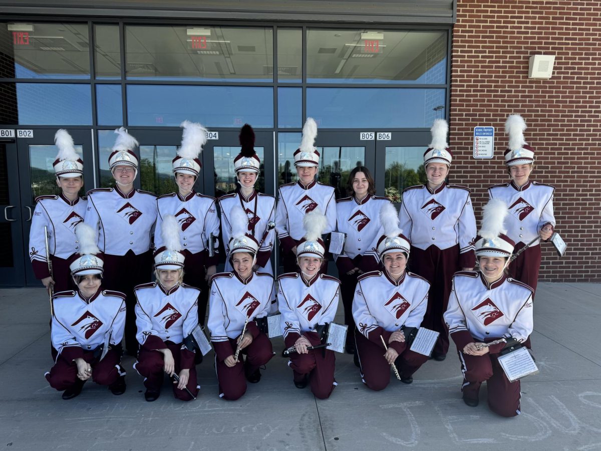 All smiles. The 2024 - 2025 flute section poses for one last photo before the annual Memorial Day parade. 