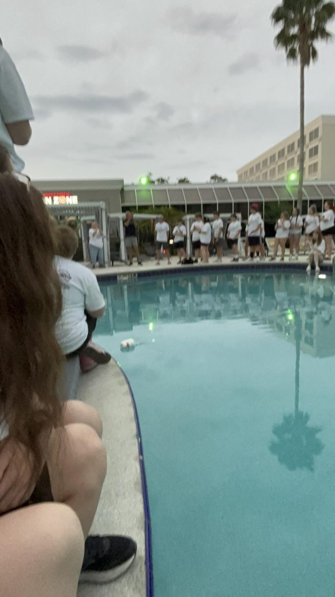 Cannonball! Music students line the pool in the early morning to watch Larry Detwiler and Ben Cossitor face off in a cannonball competition. According to the poll from Kelly Detwiler, L. Detwiler took home the win. 