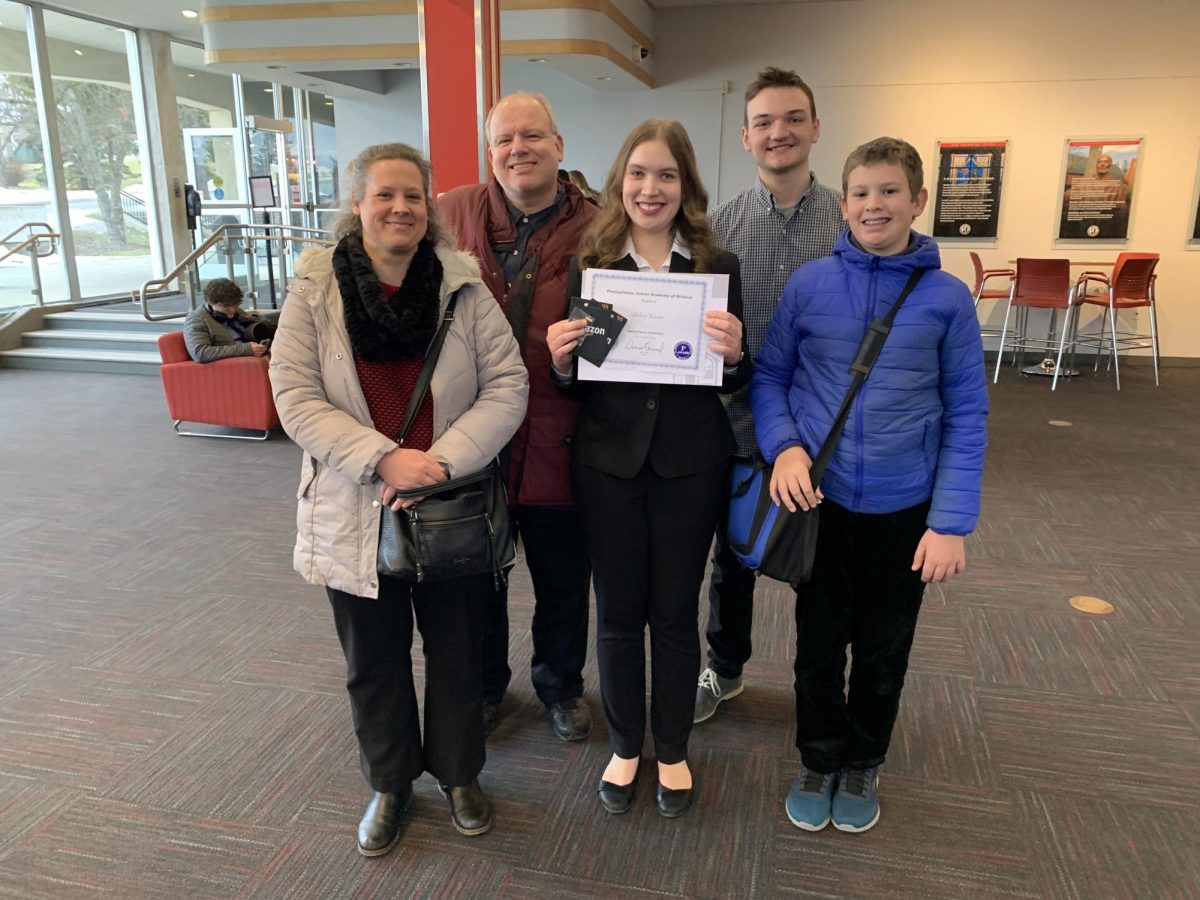Junior Melissa Krainer poses with her family after winning an award for the Pennsylvania Junior Academy of Science (courtesy of Melissa Krainer)