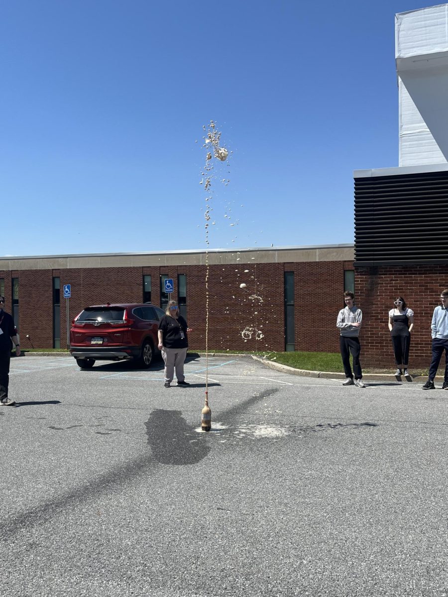 Chemistry classes participate in the yearly Coke and Mentos lab in the parking lot behind the field house. 