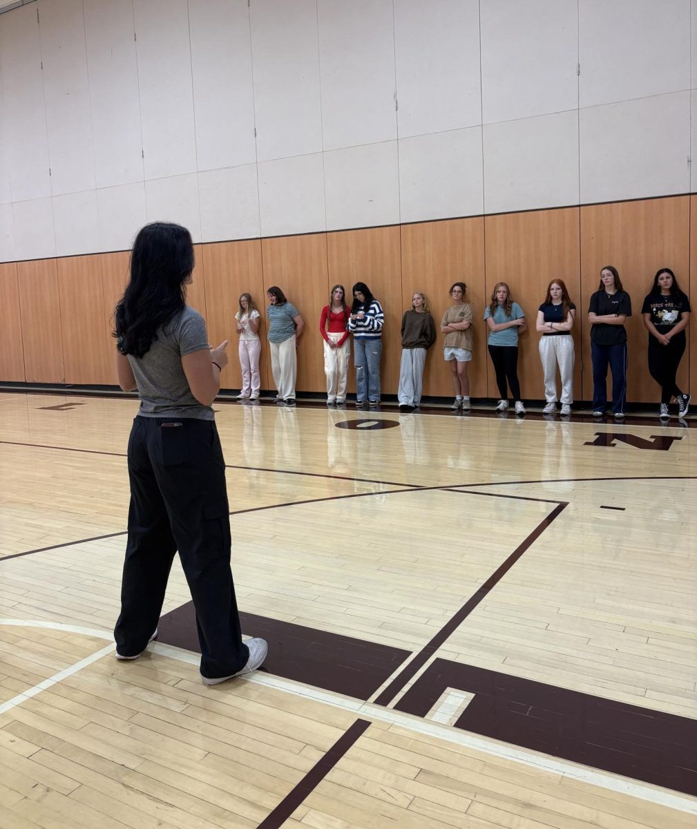 Get Hype! Jada Schellhammer explains the rules of handball to her 7th period class. Schellhammer took a love to the Physical Education major during her college years after playing collegiate softball.