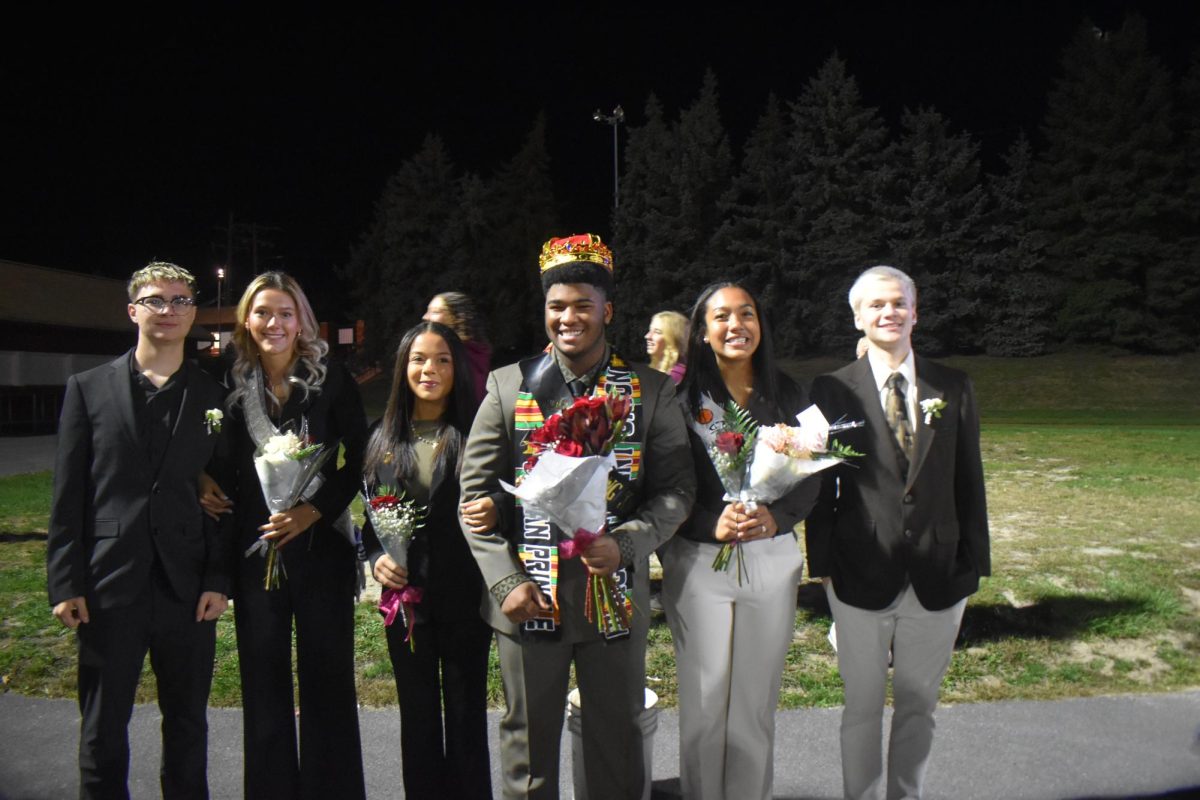 The final three. Seniors Julian Pringle, Kenzi Wilt, and Zaelinh Nguyen-Moore stand side by side to capture their winning moment together.