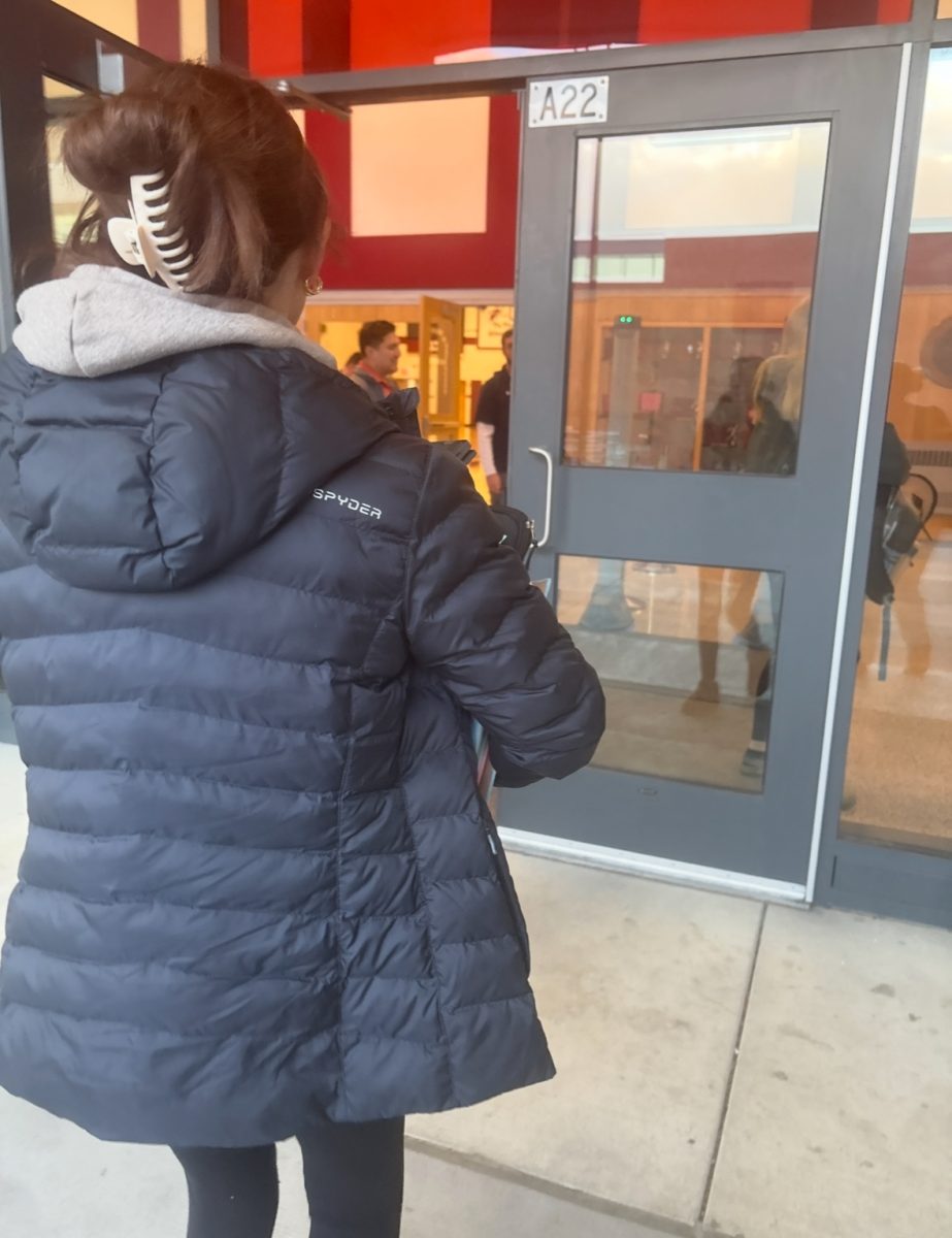Daily routine. Every day, students are required to go through metal detectors before entering the building. 