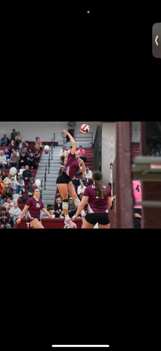 Spike. Yost jumps up to return the volleyball over the net. Her accomplishment gave her perspective about others trying to achieve the same. "I would tell them to definitely keep your head up and keep going," Yost said. "You just have to play a game at a time, practice at a time and take your time with the sport because it's a hard sport. Once you get the hang of it, it'll definitely be in your favor."
(Courtesy of Annalyse Yost)
