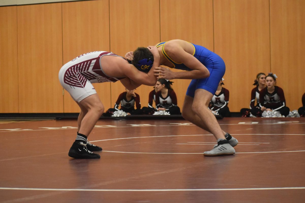 Wrestle. Sophomore Anthony Riccio wrestles his opponent. This is Riccio's second year on the team. (Courtesy of Adrielle McNeal) 