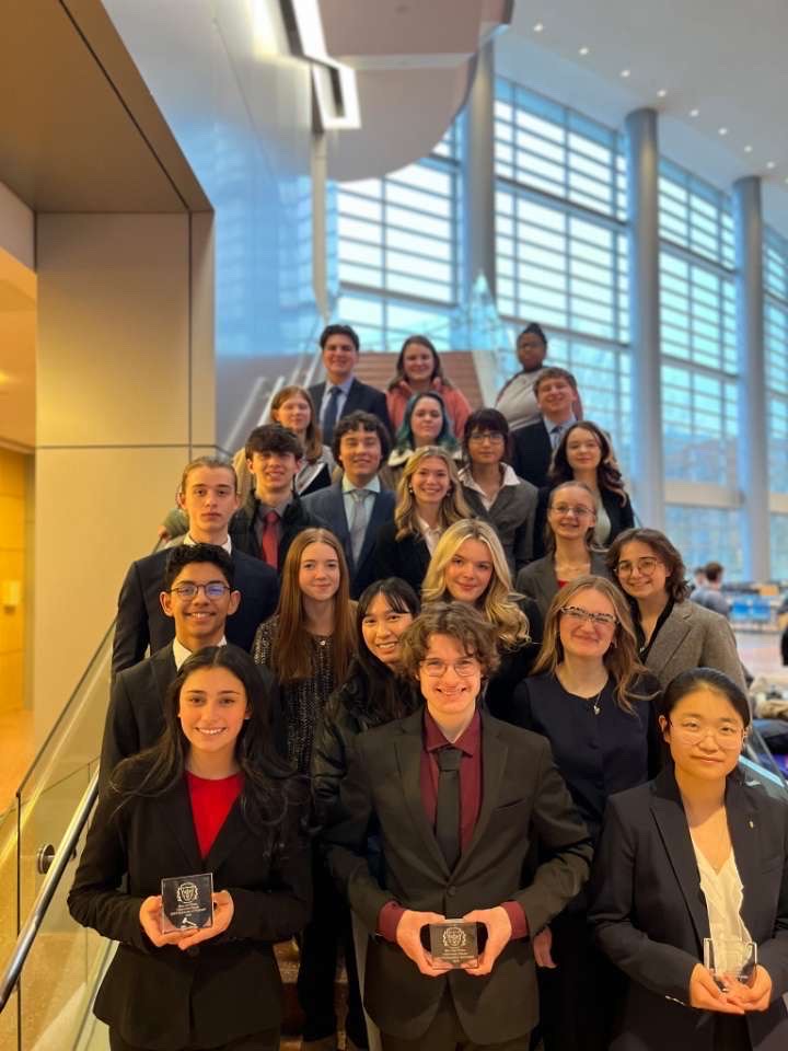 Strike a pose. The Mock Trial team pose after a competition.