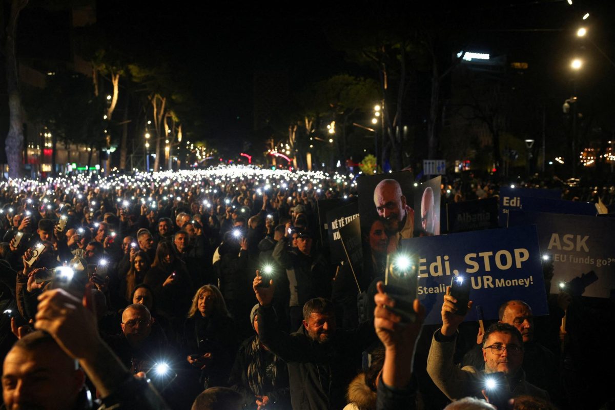 Supporters of the Albanian opposition hold lights aloft during an anti-government protest, triggered by a corruption investigation into Deputy Prime Minister Belinda Balluku, near the Prime Minister's office in Tirana, Albania, January 24, 2026. REUTERS/Florion Goga