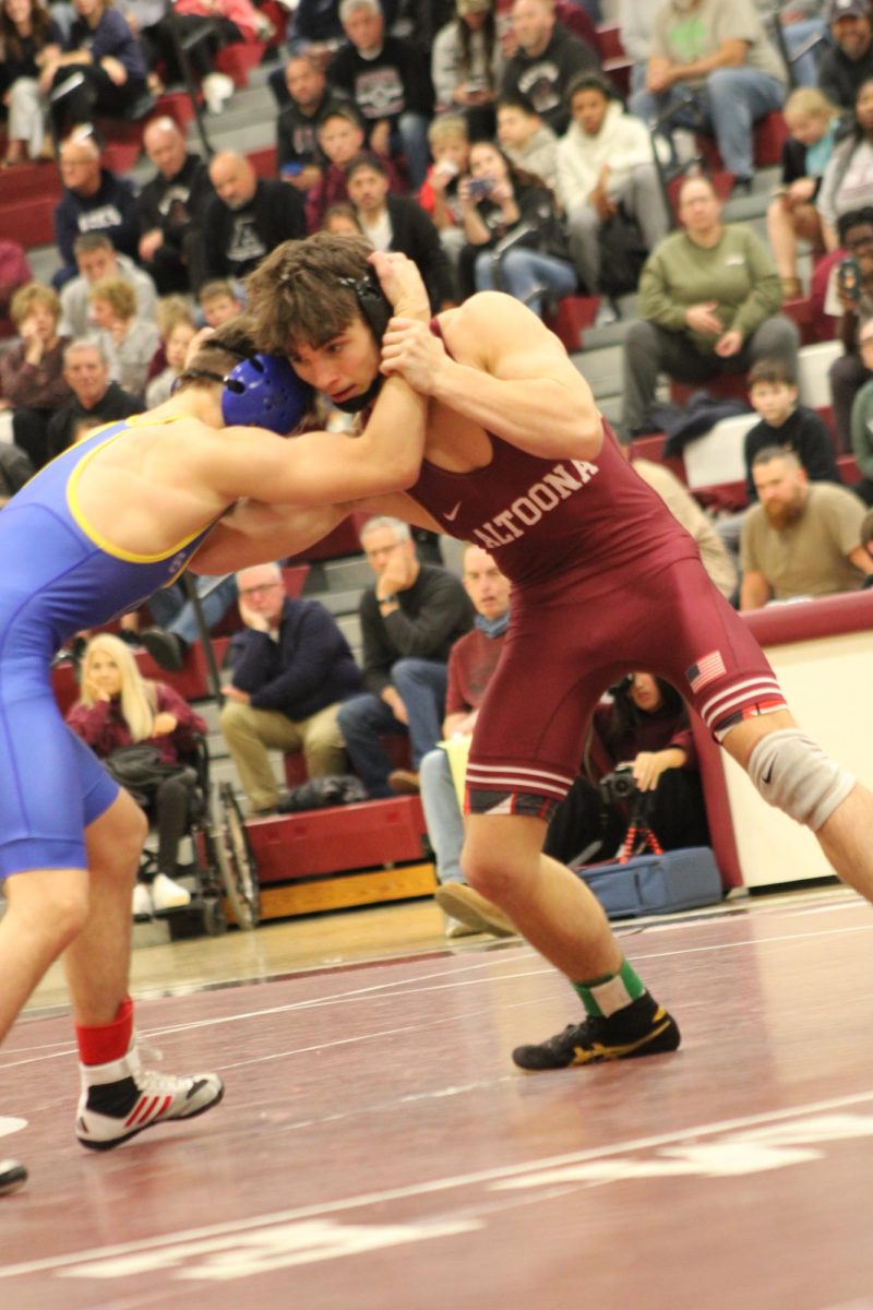 Arm Grab. Sophomore Deklan Barr grabs his opposition by the arm. Barr has been a varsity player for two years now.