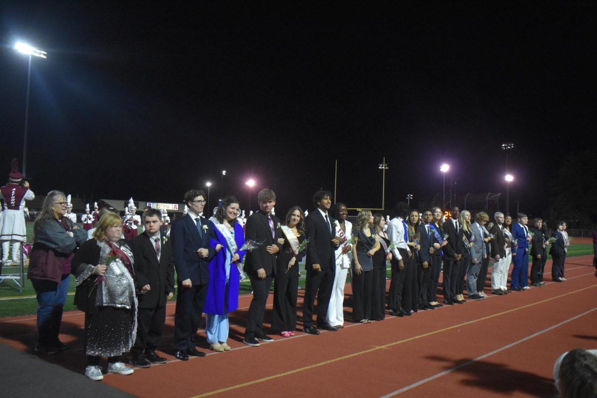 Anxious wait. Homecoming Candidates line the sidelines during Halftime. During the ceremony, the runner ups and the Homecoming Royal was announced. 