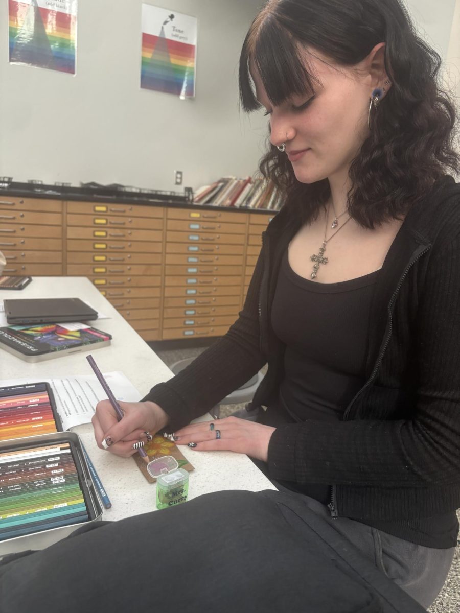 Hard at work. Students in art classes work on coffee sleeves for the Coffee Cart. The sleeves are being distributed in moderation over the next few months. 