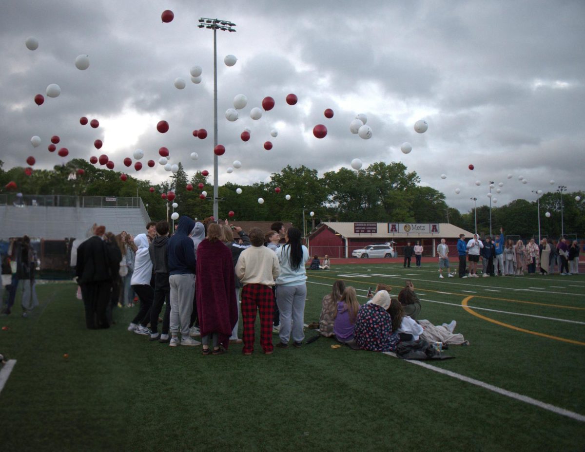 Senior's from the class of 2025 gathers together at Manson Park for the annual senior sunrise