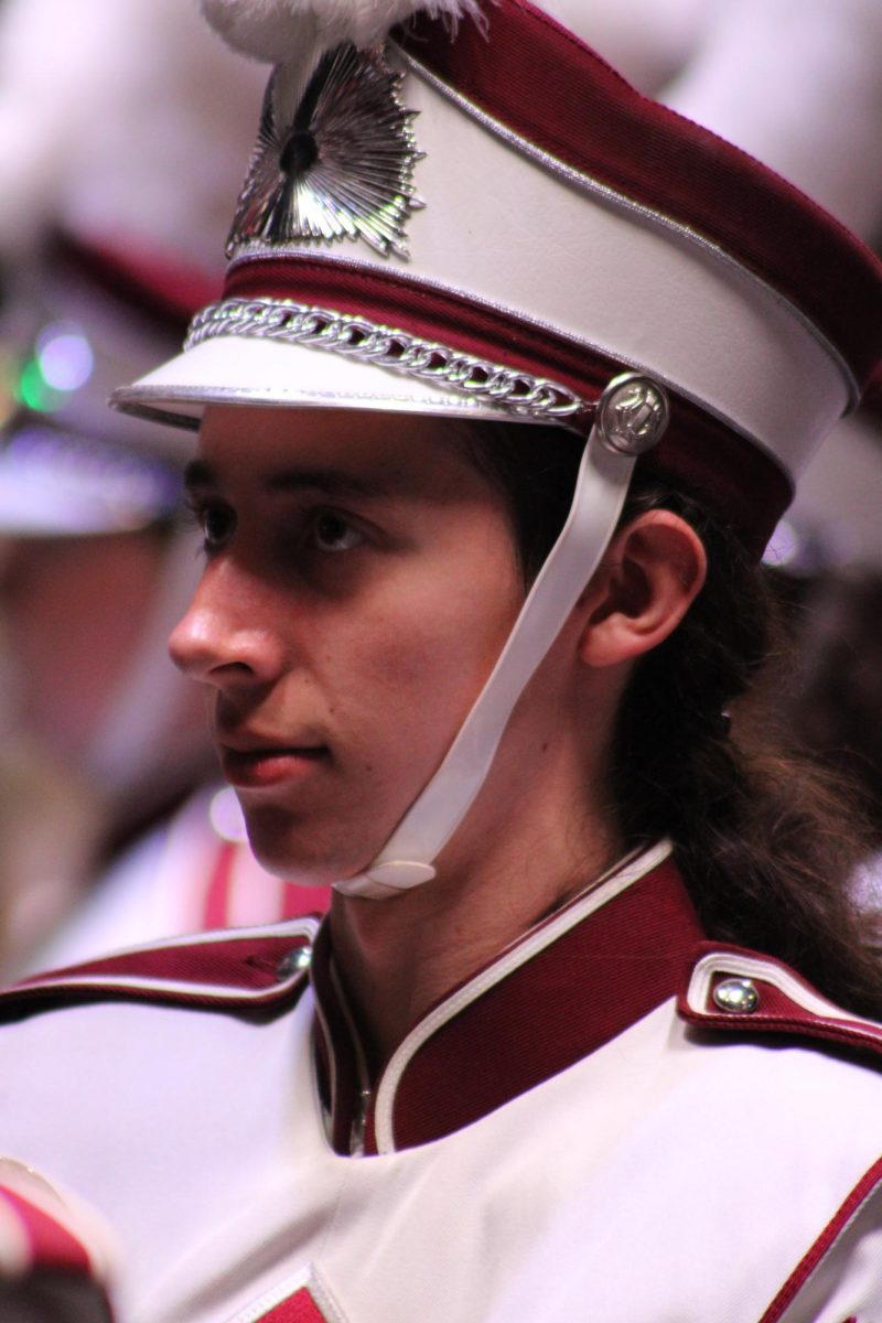 Senior Trenton Holmberg watches drum major Gracelynn Beldin for the cue to bring instruments up. Holmberg has been part of Marching Band for four years.
